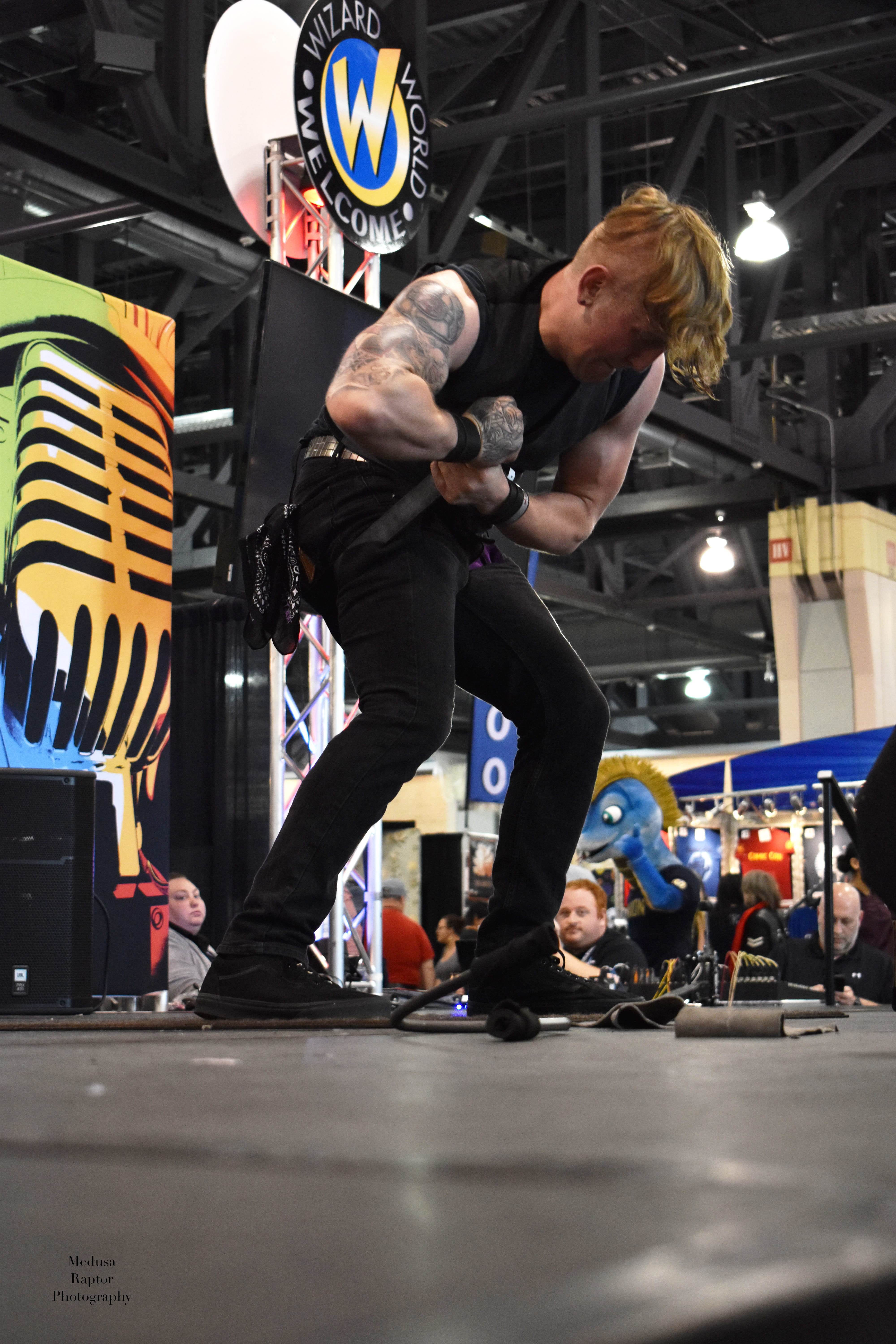 BF Reid performing feats of strength demonstration at Wizard World convention